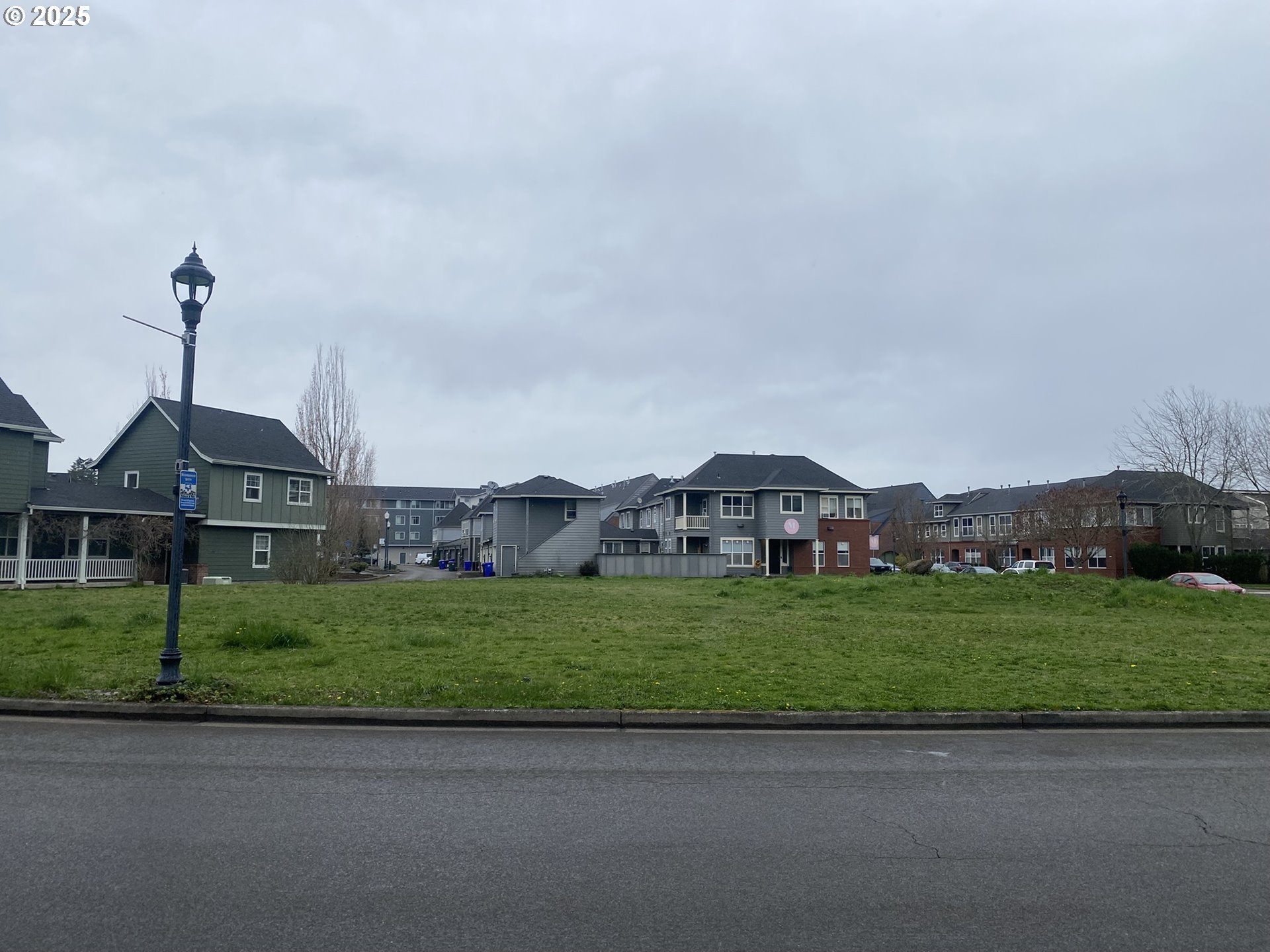 1305 Northeast Village Street Fairview, OR 97024 - Photo 7 of 11 a front view of a house with a yard and garage