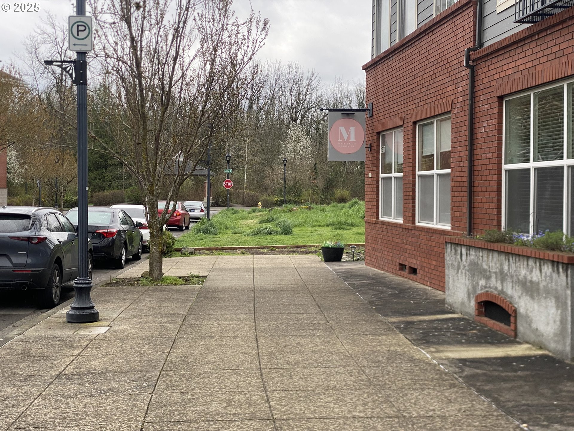 1305 Northeast Village Street Fairview, OR 97024 - Photo 8 of 11 a view of a building with cars parked on road