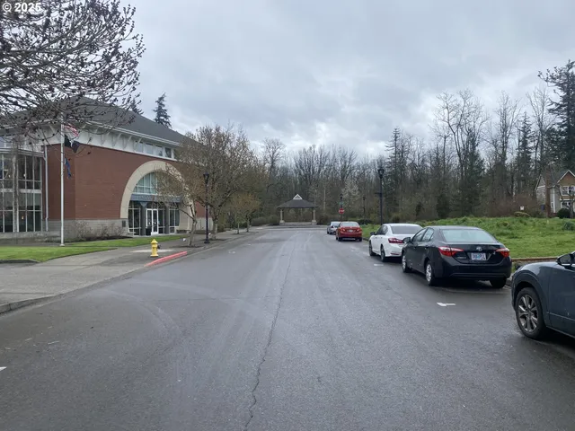 a view of street with parked cars