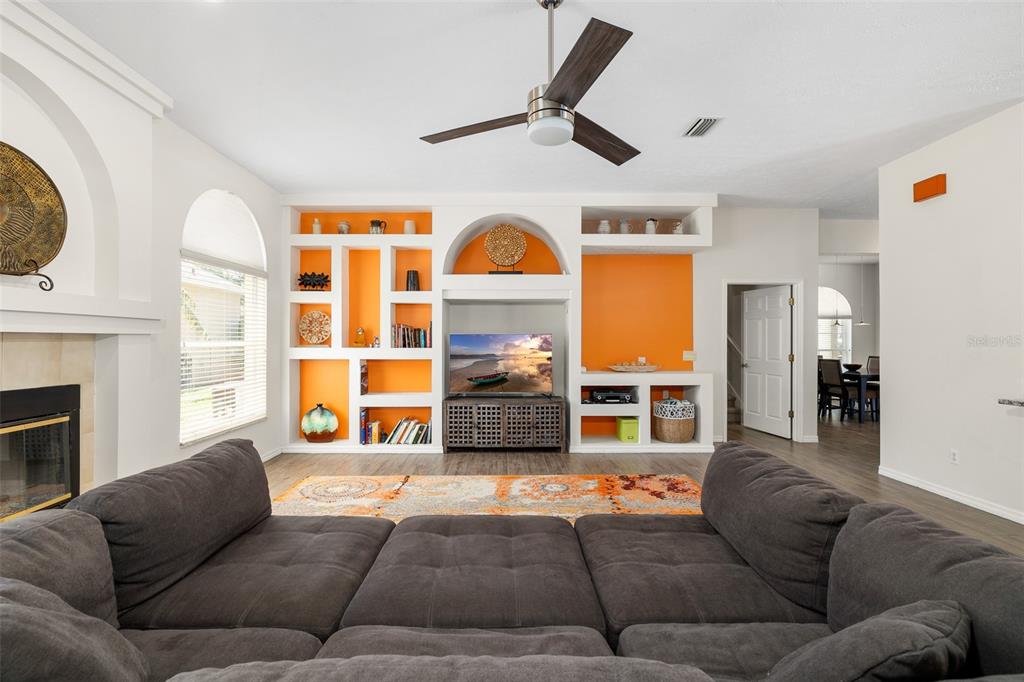 2513 Regal River Road Valrico, FL 33596 - Photo 18 of 46 a living room with fireplace furniture and a window