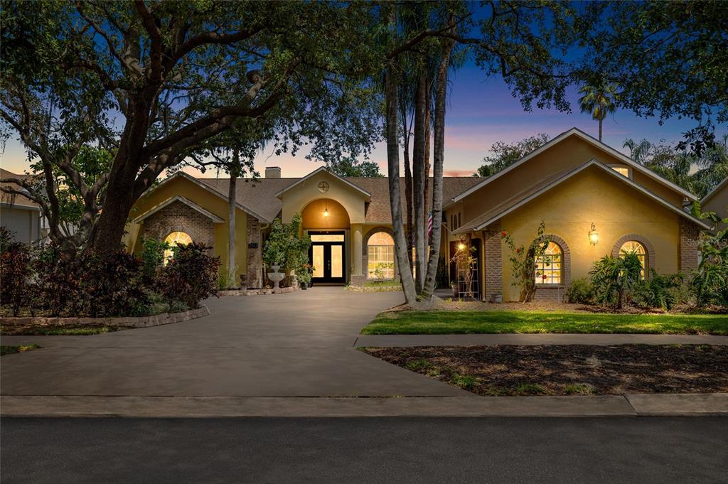 2513 Regal River Road Valrico, FL 33596 - Photo 2 of 46 a front view of a house with a yard