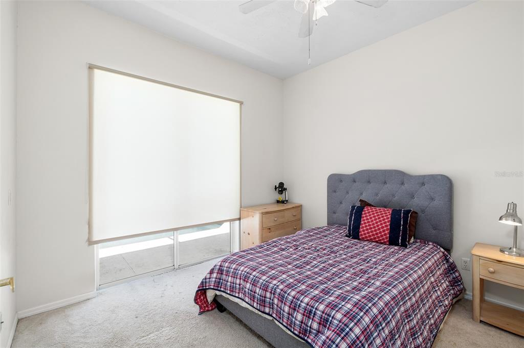 2513 Regal River Road Valrico, FL 33596 - Photo 30 of 46 a bedroom with a bed and a large mirror