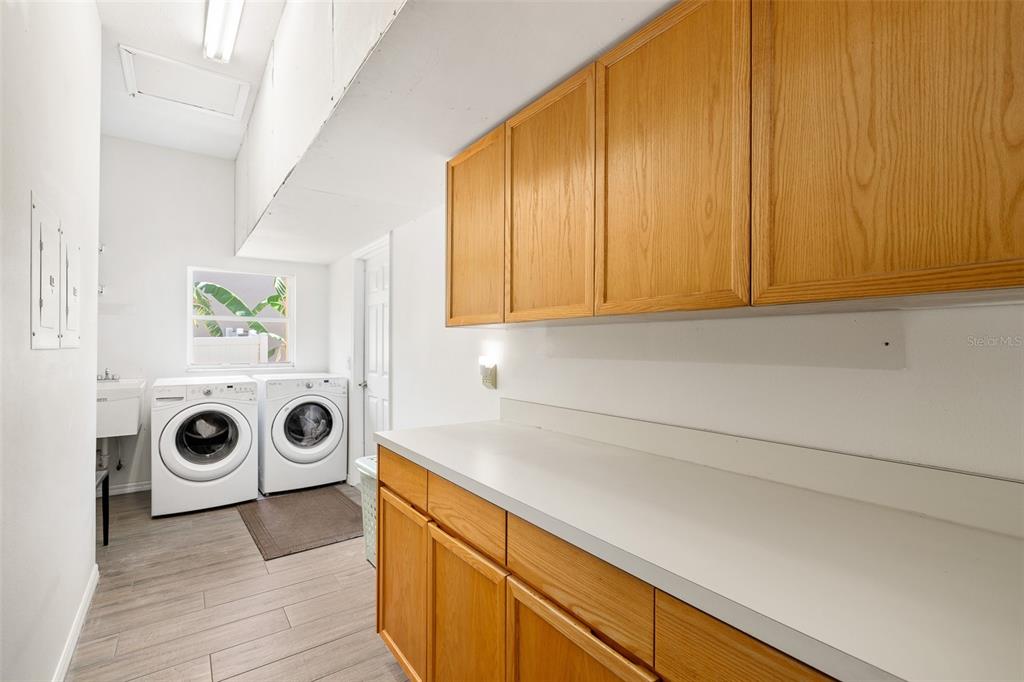2513 Regal River Road Valrico, FL 33596 - Photo 37 of 46 a kitchen with a stove and a microwave with wooden floor