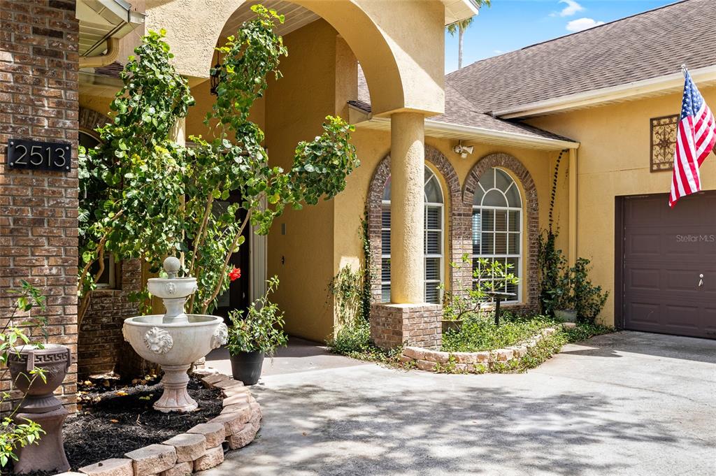 2513 Regal River Road Valrico, FL 33596 - Photo 5 of 46 a view of a house with potted plants