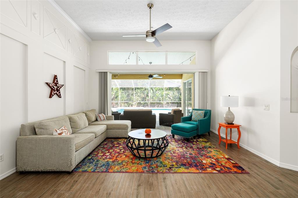 2513 Regal River Road Valrico, FL 33596 - Photo 7 of 46 a living room with furniture large window and wooden floor