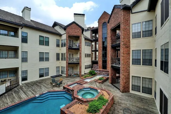 a front view of a house with outdoor seating