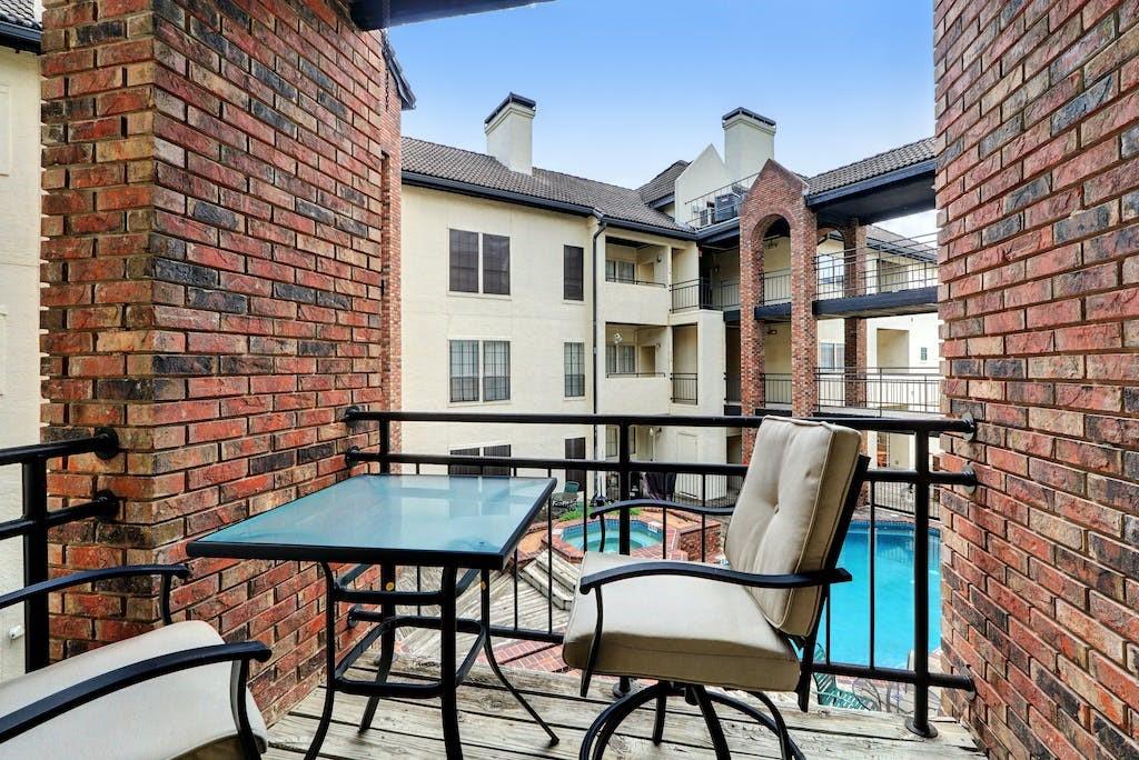 3001 Cedar Street, Unit 204 Austin, TX 78705 - Photo 20 of 20 a front view of a house with outdoor seating