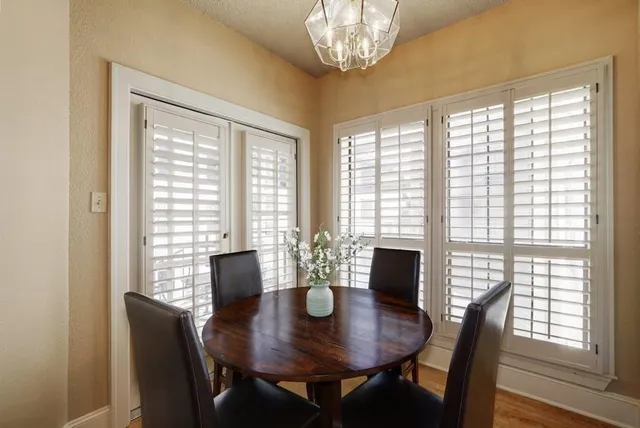 a view of a dining room with furniture and window
