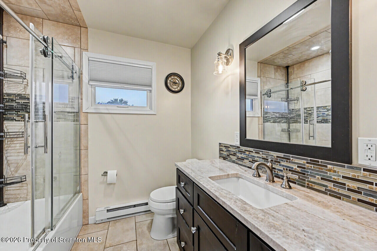 121 T Rt 351 Moscow, PA 18444 - Photo 53 of 79 a bathroom with a granite countertop sink toilet and shower
