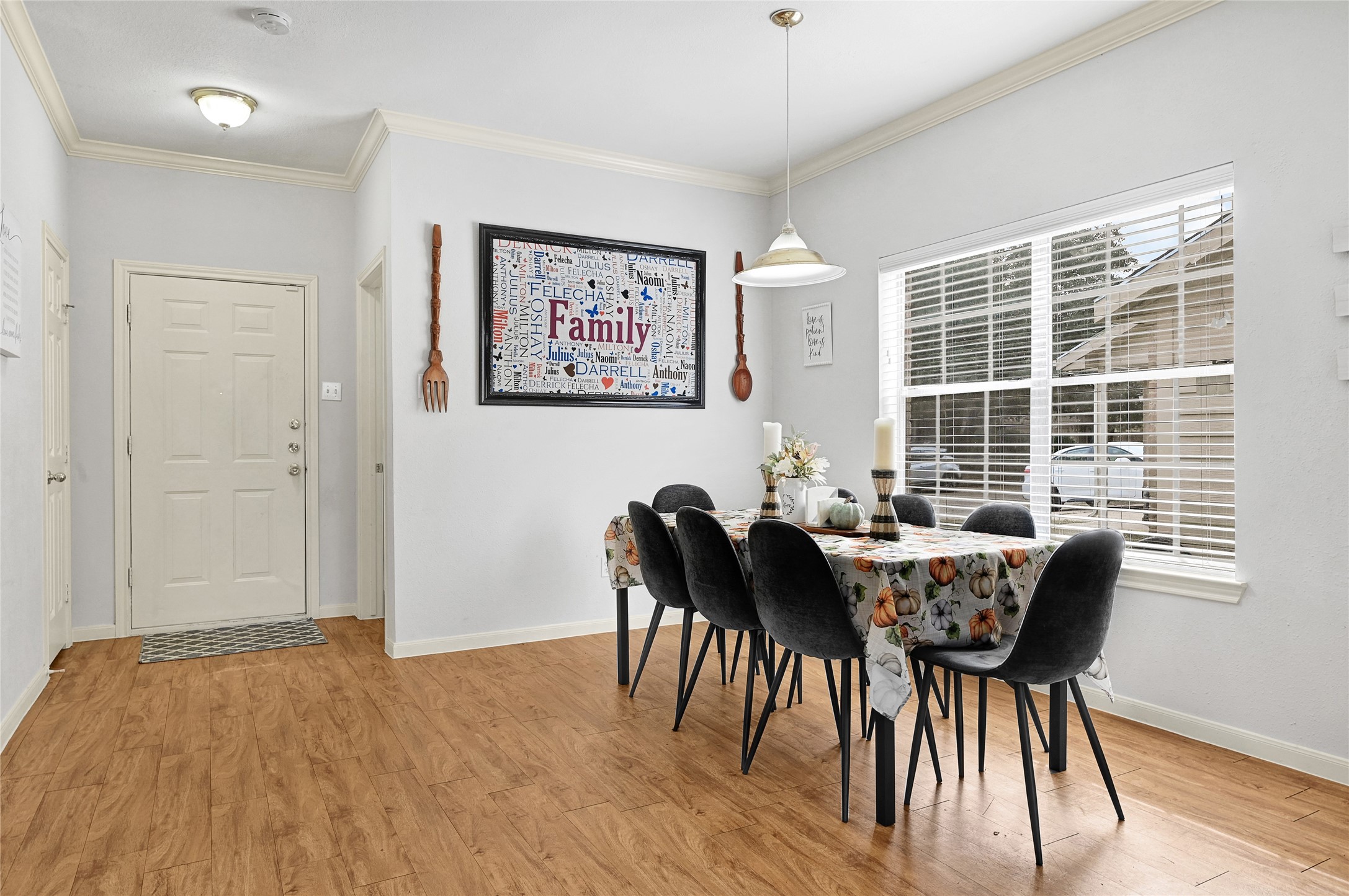 10100 Spring Pl Drive Houston, TX 77070 - Photo 5 of 24 a view of a dining room with furniture and wooden floor