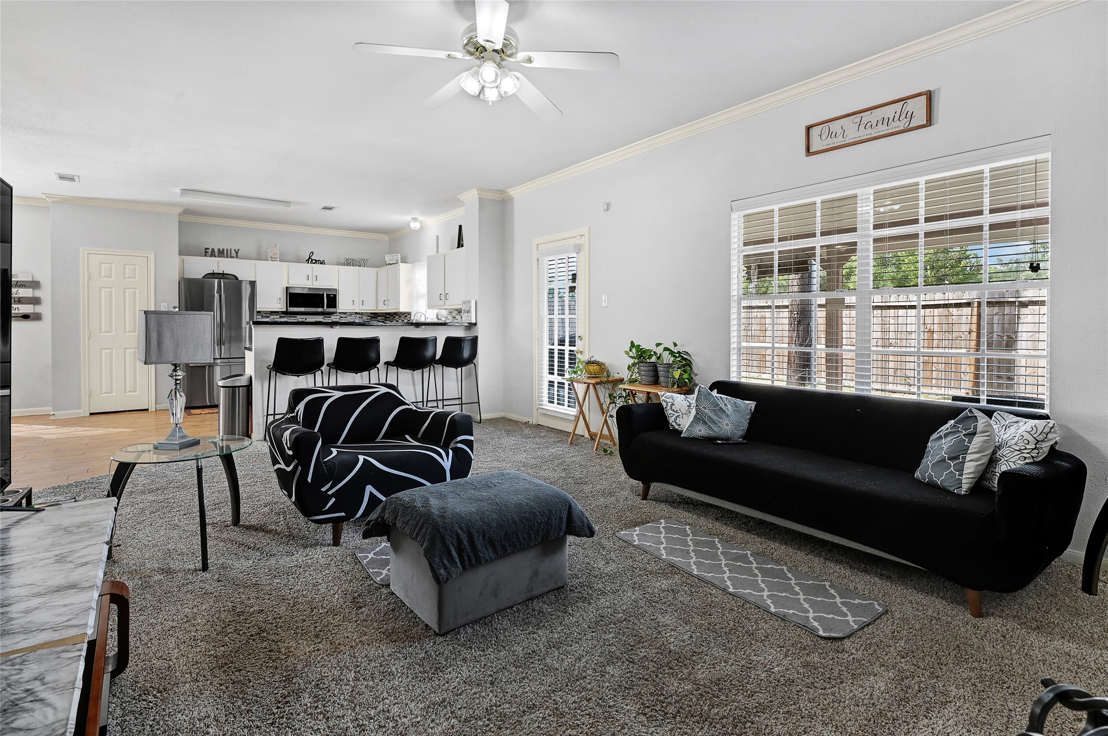 10100 Spring Pl Drive Houston, TX 77070 - Photo 9 of 24 a living room with furniture and a large window