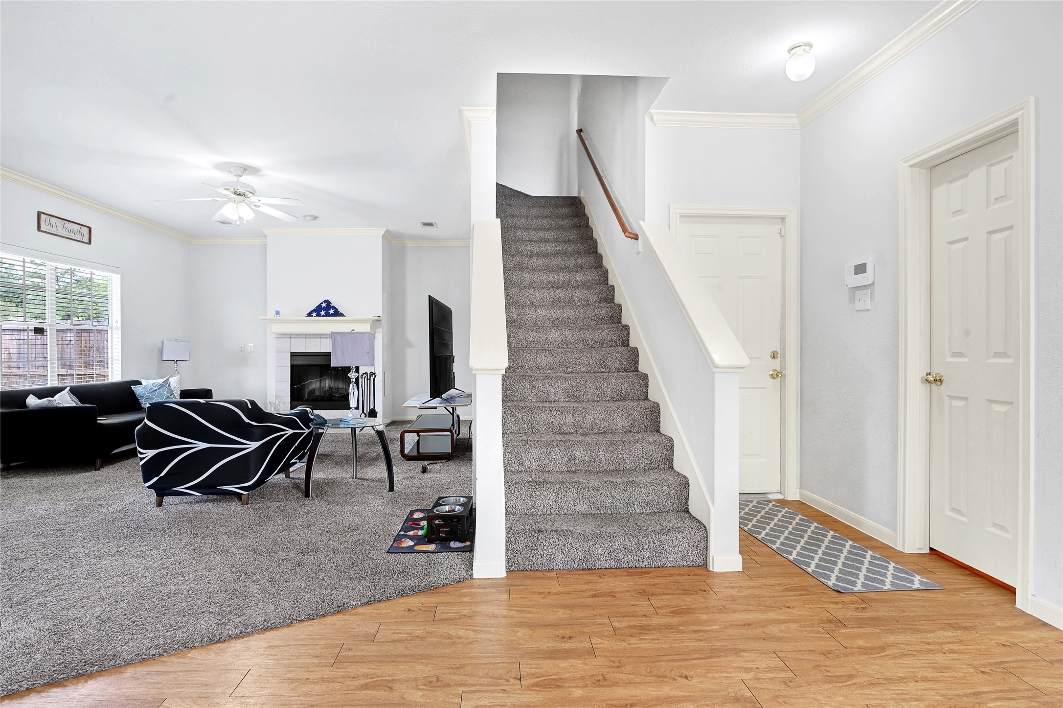 10100 Spring Pl Drive Houston, TX 77070 - Photo 10 of 24 a living room with furniture and a fireplace