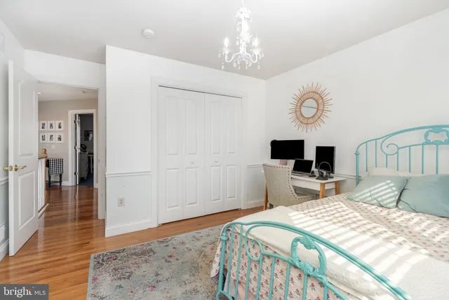 a bedroom with a bed and a television