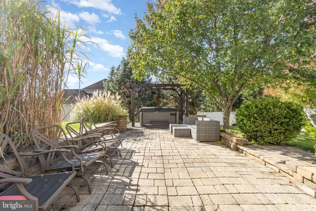 an aerial view of a house with a yard and lake view
