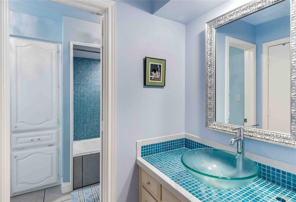 216 McMillen Road Lucas, TX 75002 - Photo 33 of 36 a bathroom with a granite countertop sink and a mirror