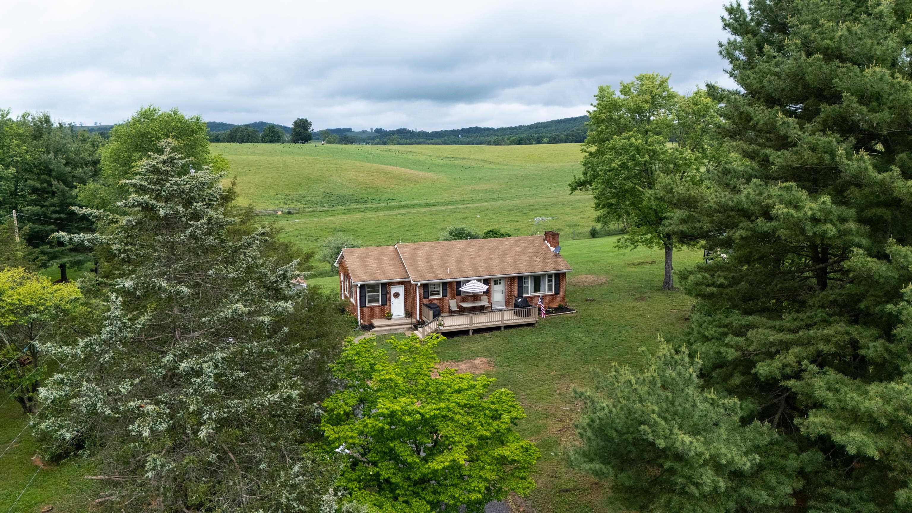 7827 Lee Highway Raphine, VA 24472 - Photo 48 of 62 an aerial view of a house with garden space and street view