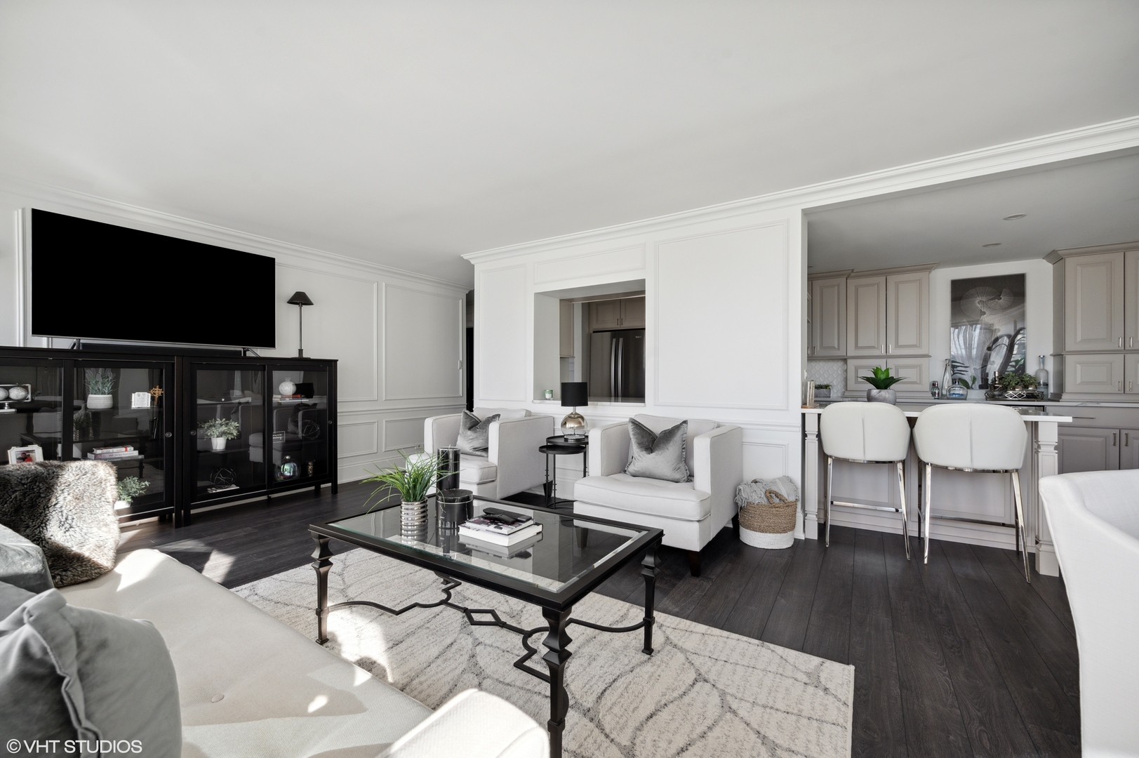 111 East Chestnut Street, Unit 26J Chicago, IL 60611 - Photo 11 of 23 a living room with furniture a flat screen tv and a fireplace
