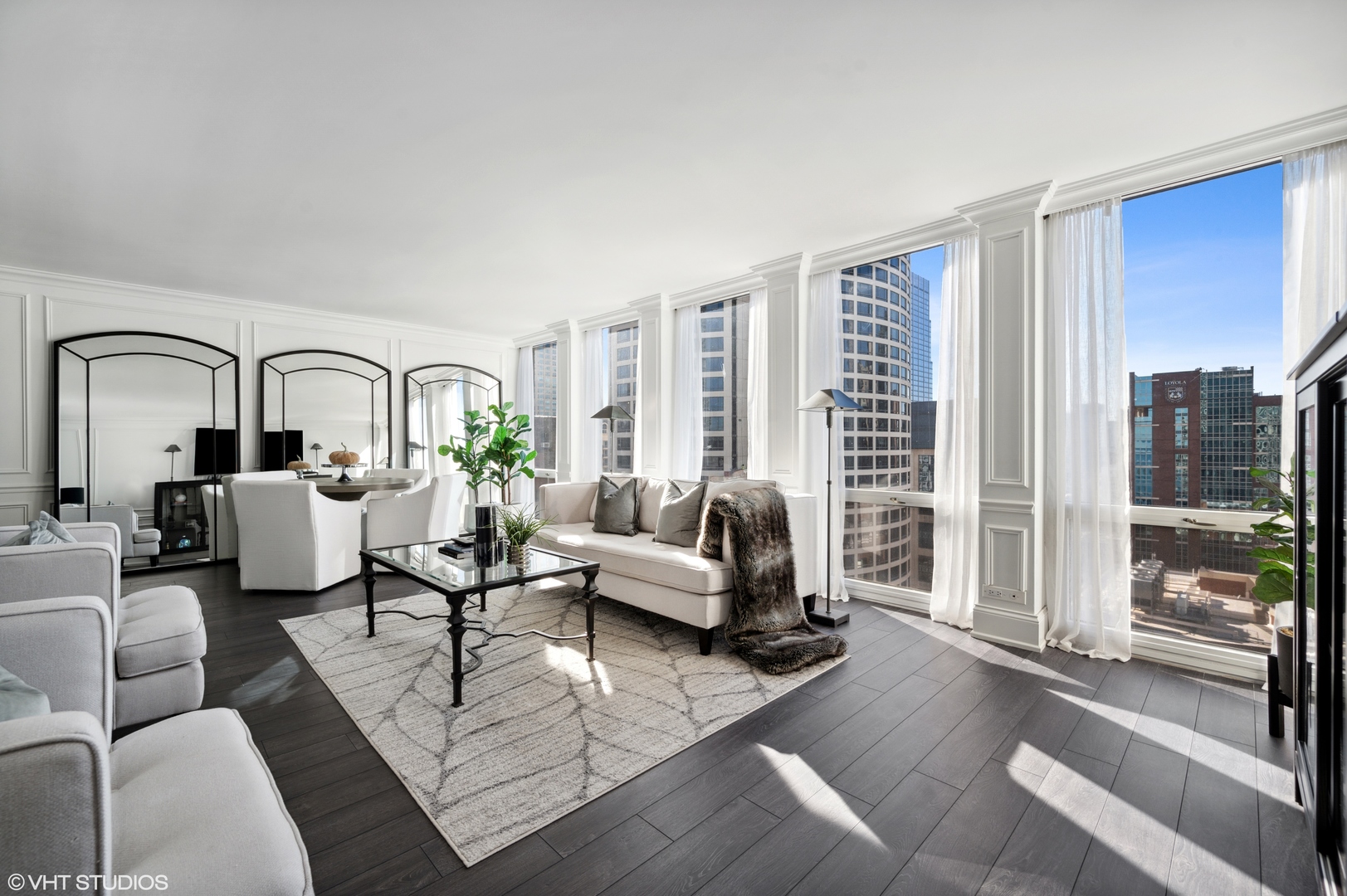 111 East Chestnut Street, Unit 26J Chicago, IL 60611 - Photo 12 of 23 a living room with furniture and a large window