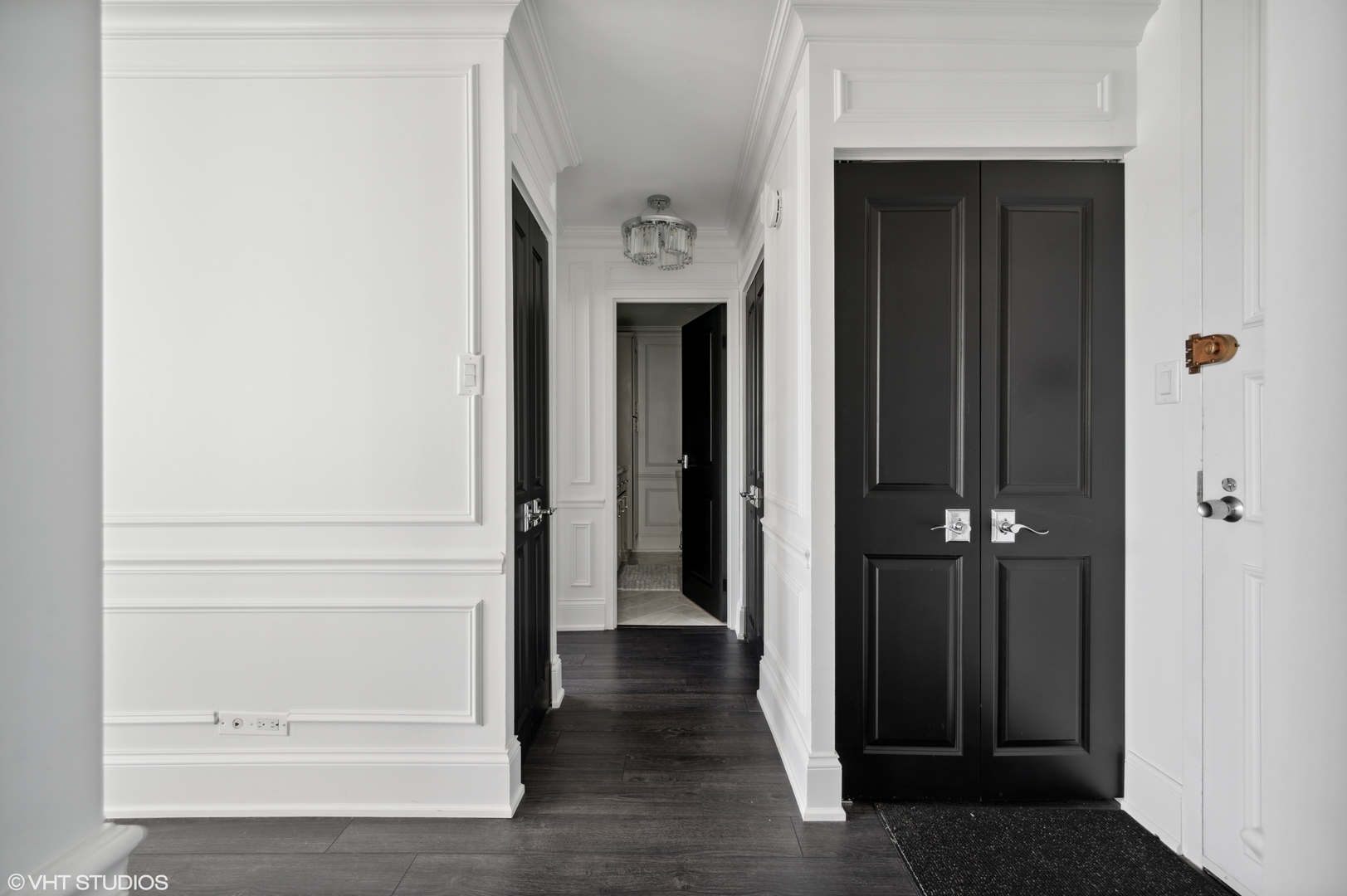 111 East Chestnut Street, Unit 26J Chicago, IL 60611 - Photo 14 of 23 a view of a hallway with wooden floor