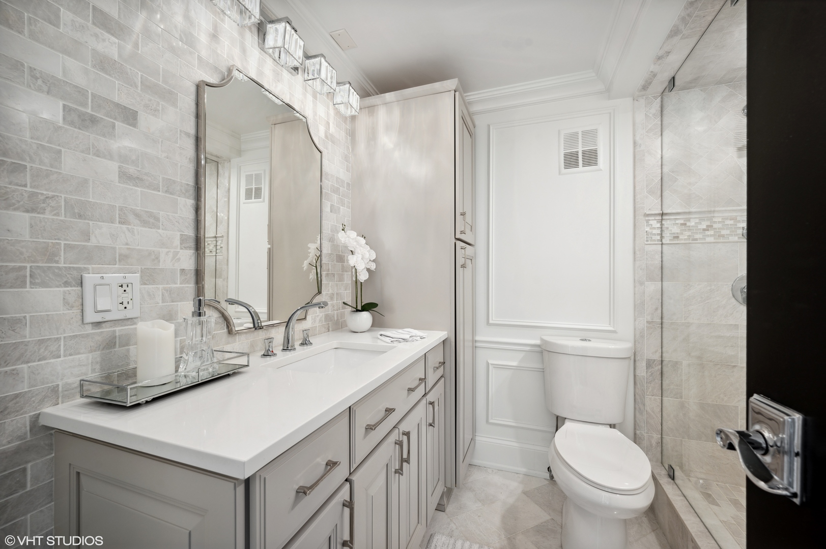 111 East Chestnut Street, Unit 26J Chicago, IL 60611 - Photo 16 of 23 a bathroom with a sink toilet vanity and shower