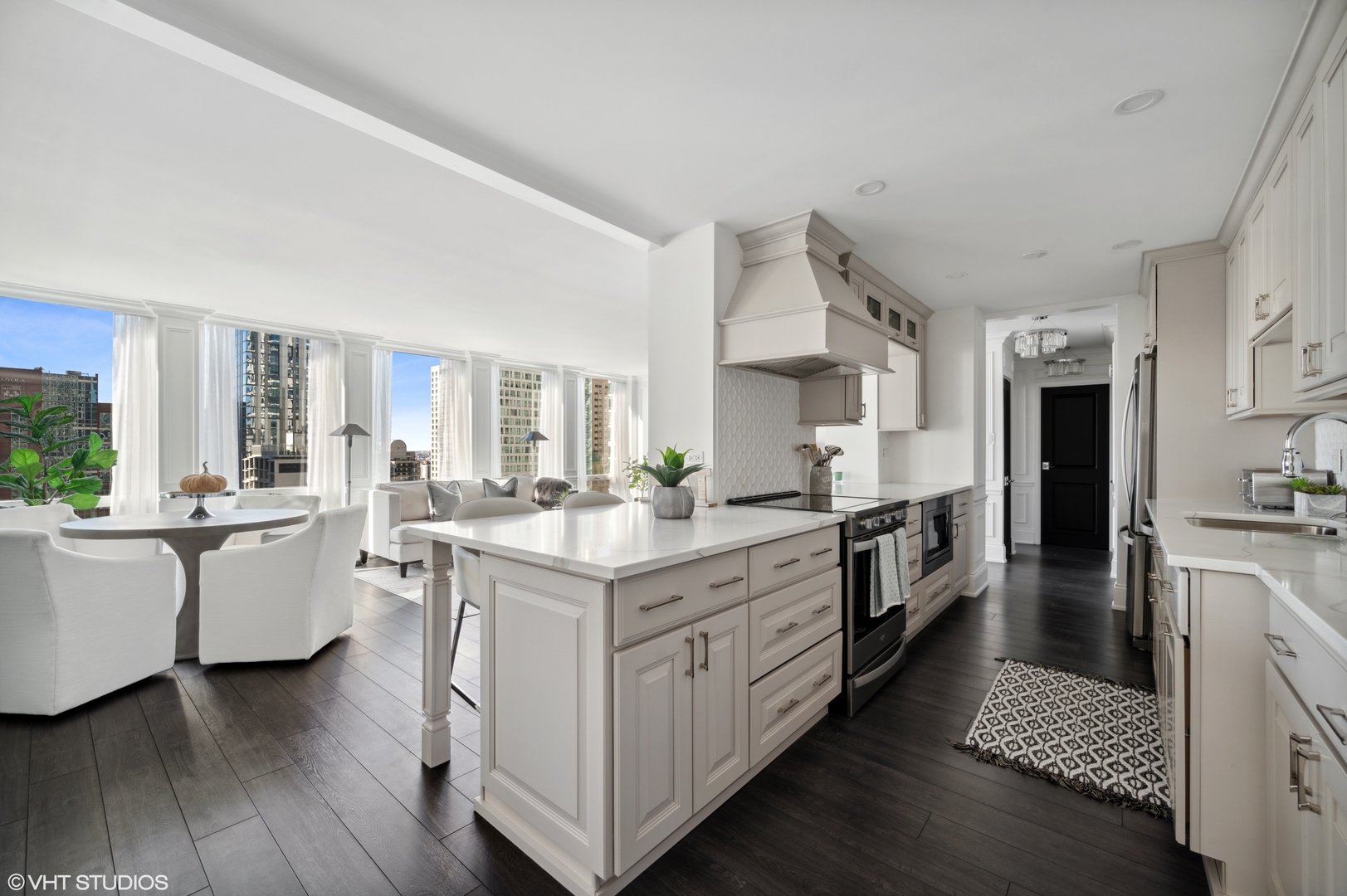 111 East Chestnut Street, Unit 26J Chicago, IL 60611 - Photo 3 of 23 a large kitchen with a lot of counter space and a wooden floor