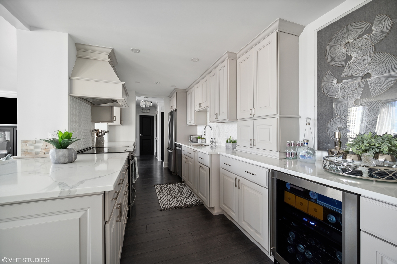 111 East Chestnut Street, Unit 26J Chicago, IL 60611 - Photo 5 of 23 a kitchen with a sink stove and cabinets