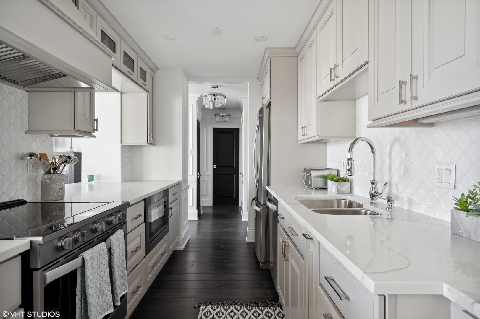 111 East Chestnut Street, Unit 26J Chicago, IL 60611 - Photo 7 of 23 a kitchen with stainless steel appliances granite countertop a sink stove and cabinets