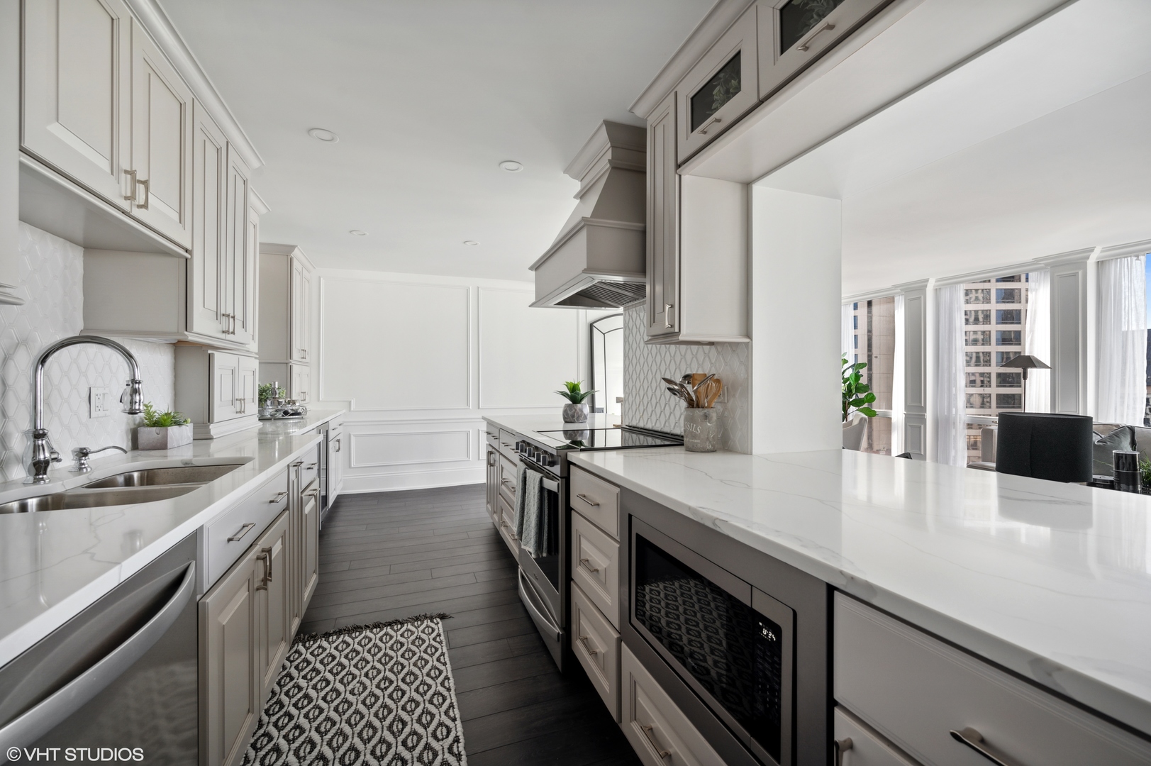 111 East Chestnut Street, Unit 26J Chicago, IL 60611 - Photo 8 of 23 a kitchen with stainless steel appliances a sink stove and cabinets