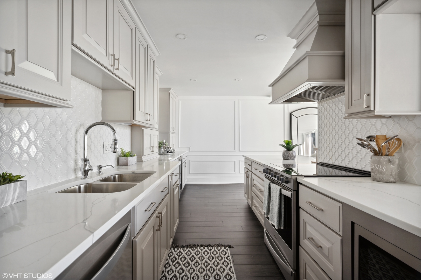 111 East Chestnut Street, Unit 26J Chicago, IL 60611 - Photo 9 of 23 a kitchen with granite countertop a sink stove and cabinets