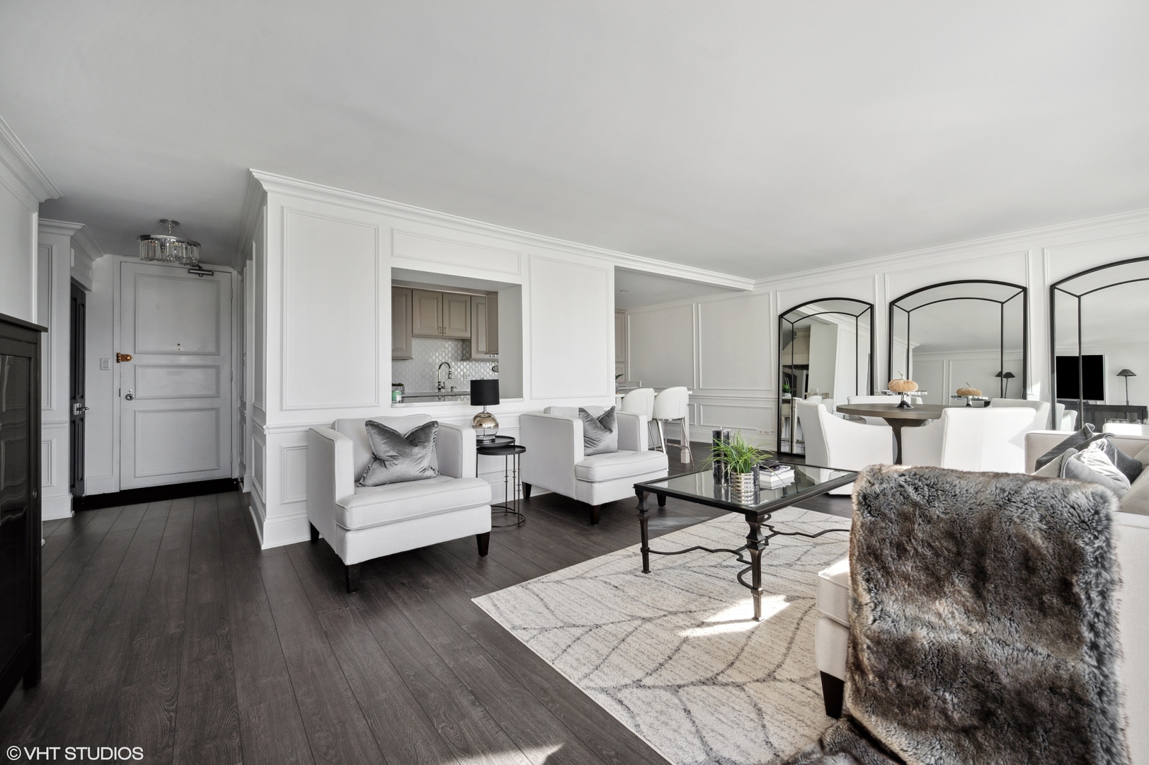 111 East Chestnut Street, Unit 26J Chicago, IL 60611 - Photo 10 of 23 a living room with furniture and a wooden floor