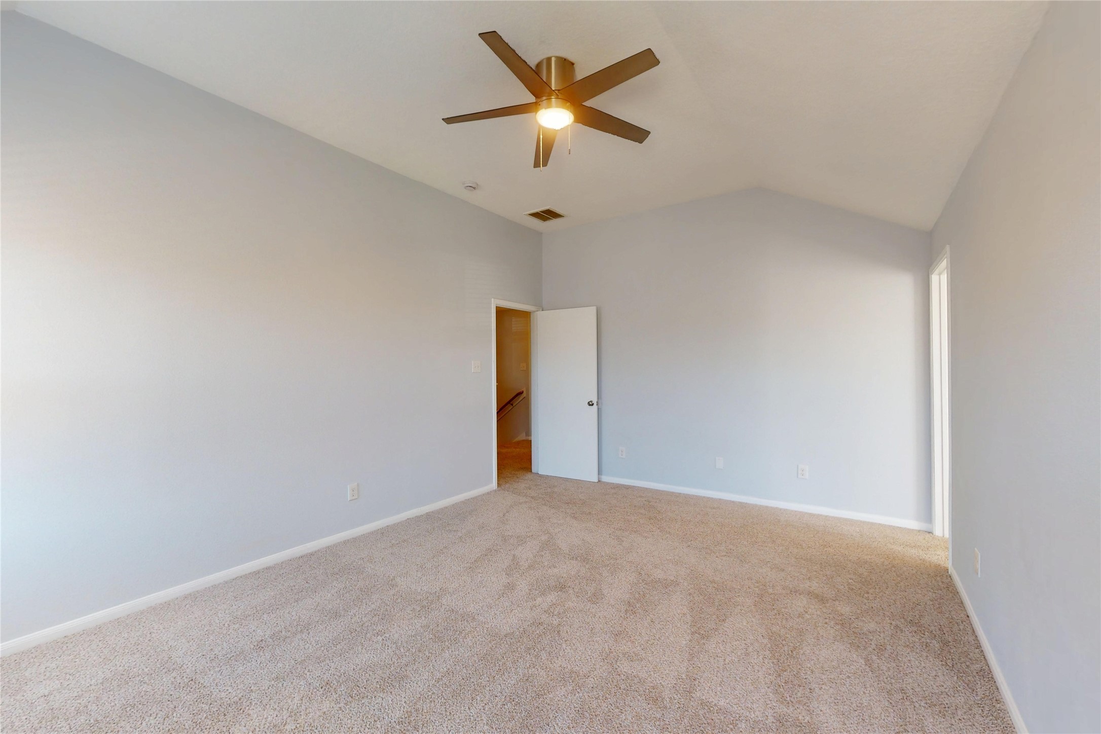 9877 Lace Flower Way Conroe, TX 77385 - Photo 21 of 43 Another view of the primary bedroom with its fresh paint.