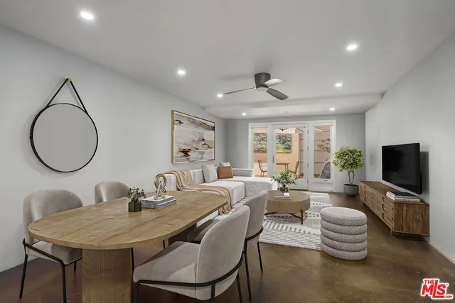 a living room with fireplace furniture and a flat screen tv