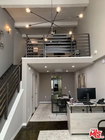 a kitchen with a table and chairs