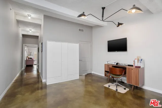 a view of a workspace with furniture