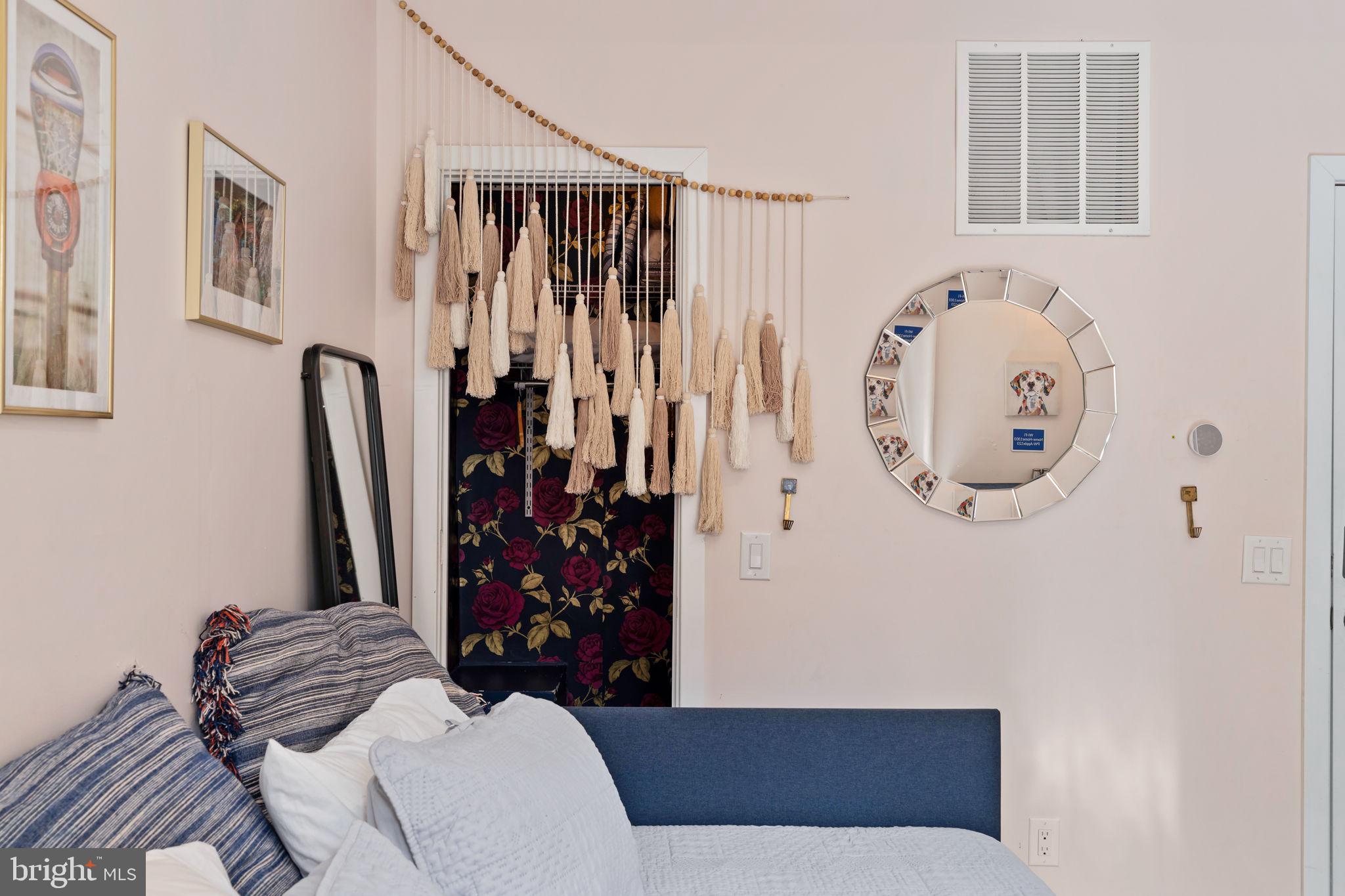 1303 Hope Street, Unit B Philadelphia, PA 19122 - Photo 5 of 16 a living room with furniture and a window