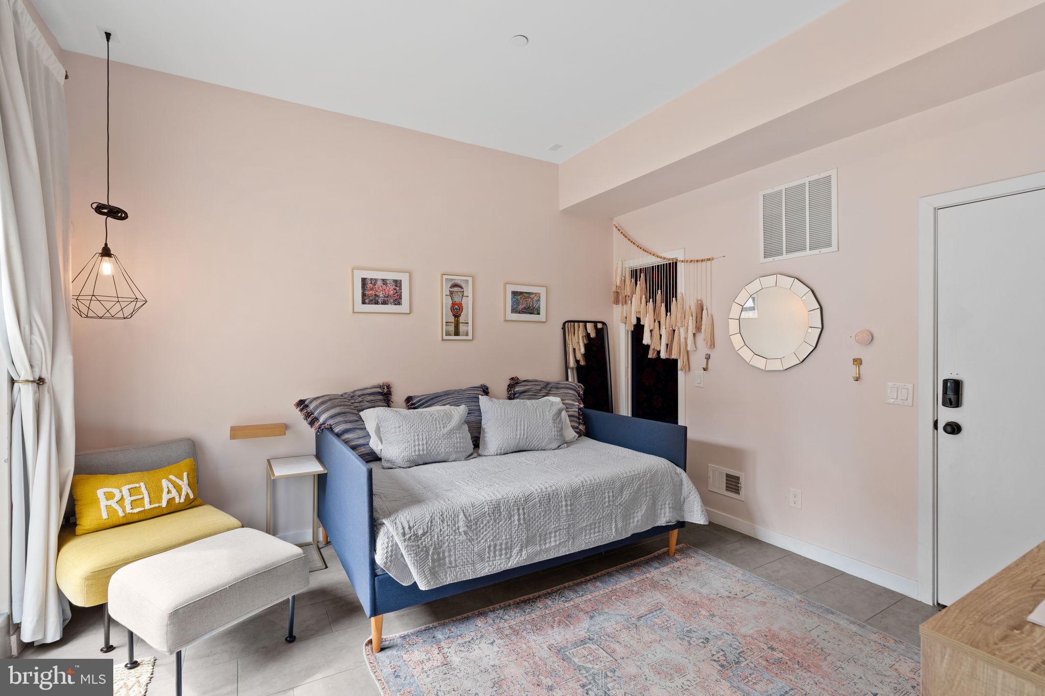 1303 Hope Street, Unit B Philadelphia, PA 19122 - Photo 9 of 16 a living room with furniture and a table