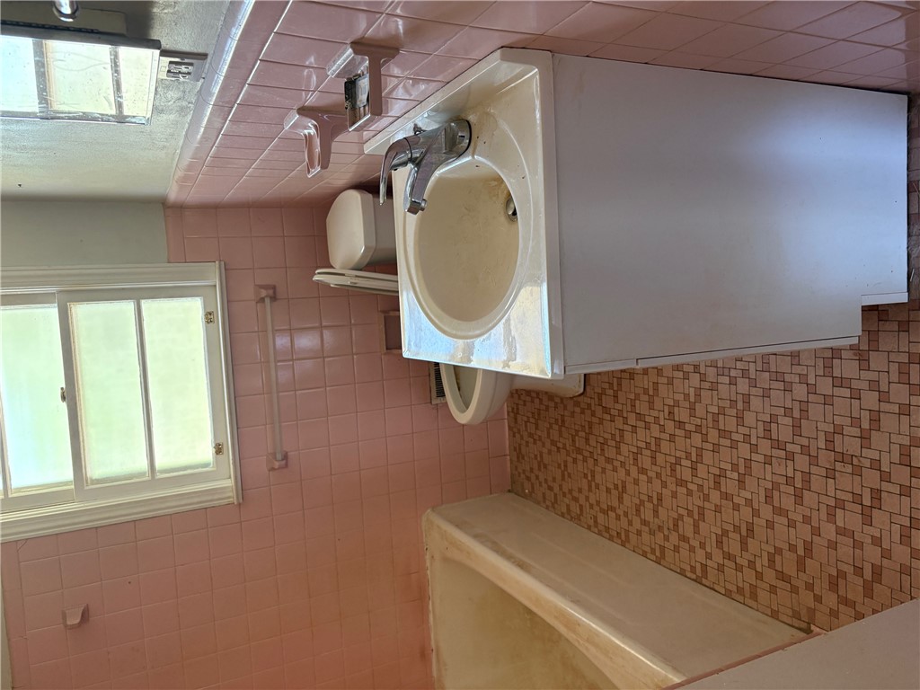 403 Brook Forest Drive Anderson, SC 29621 - Photo 13 of 18 This bright bathroom features a vanity with ample storage and a window for natural light.