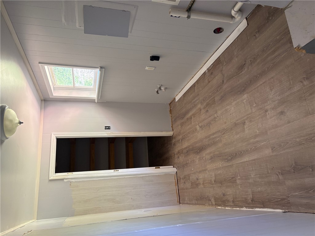 403 Brook Forest Drive Anderson, SC 29621 - Photo 4 of 18 This versatile interior space features durable flooring and a bright skylight, ready for your creative vision.
