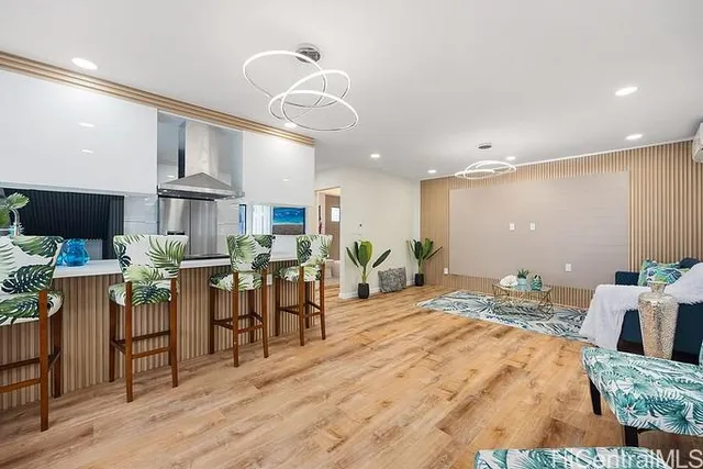 a bedroom with furniture and a large window