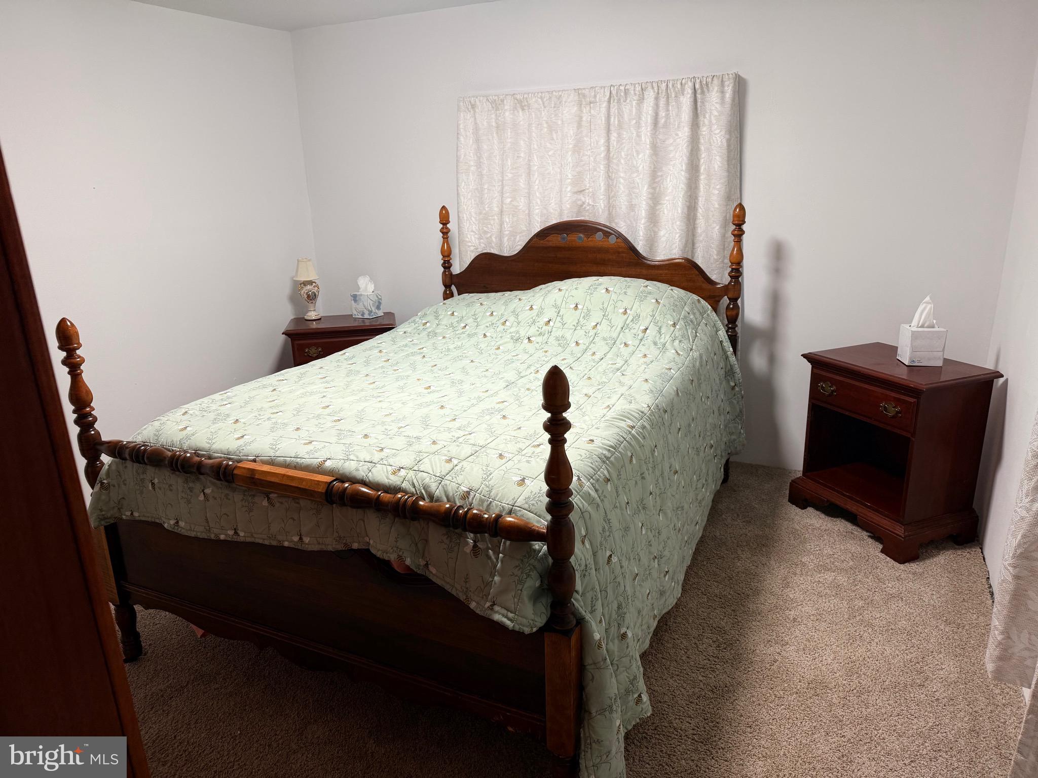1910 Schubert Road, Unit 4 Bethel, PA 19507 - Photo 11 of 14 a living room with a bed and furniture