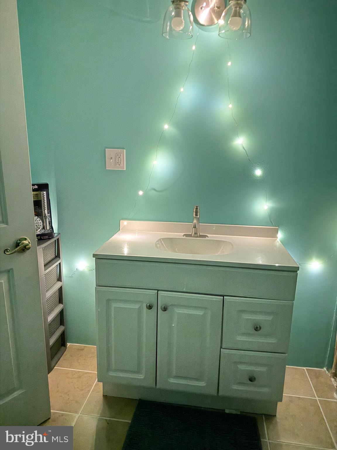 1910 Schubert Road, Unit 4 Bethel, PA 19507 - Photo 14 of 14 a bathroom with a sink and a mirror