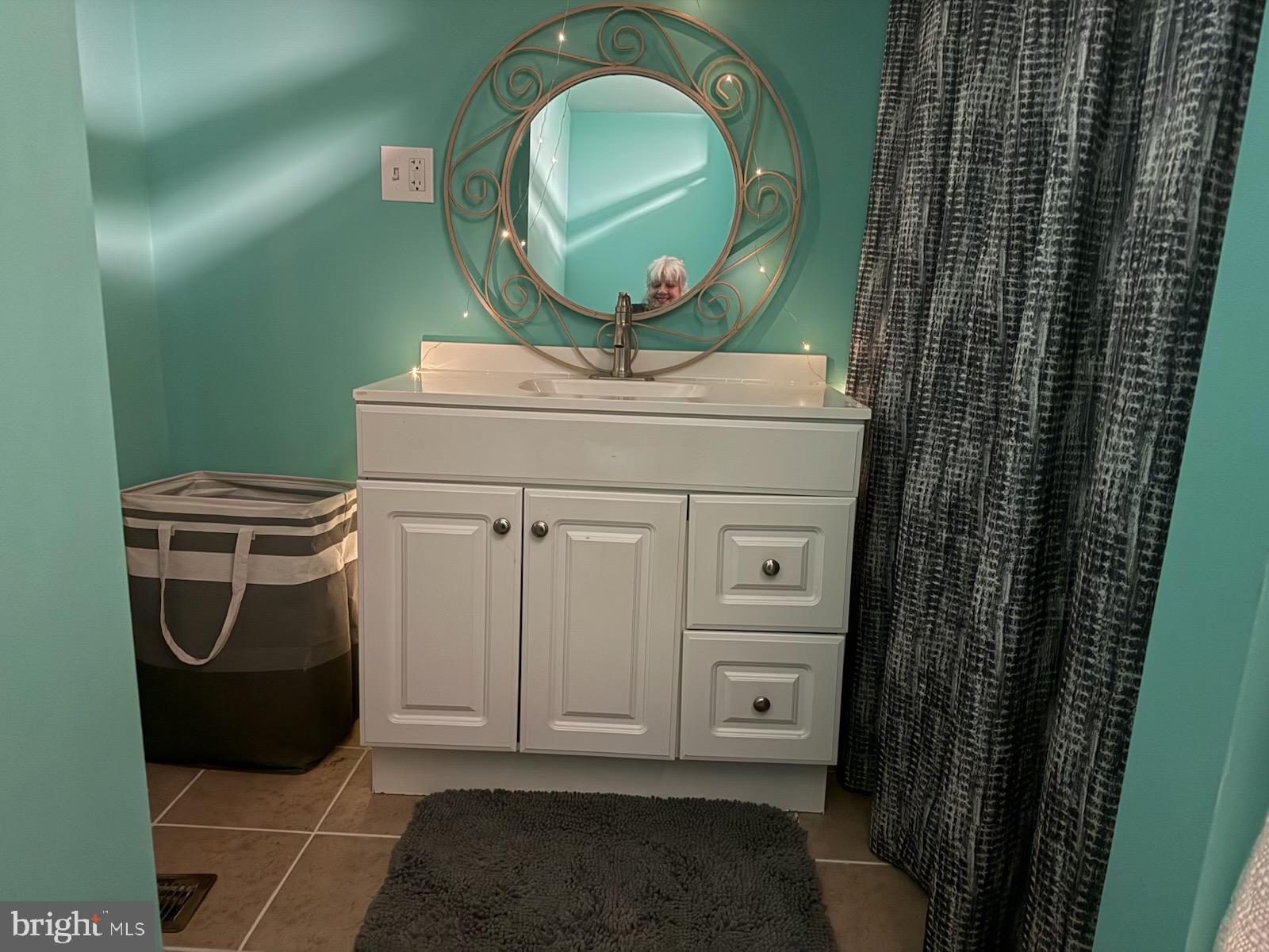 1910 Schubert Road, Unit 4 Bethel, PA 19507 - Photo 14 of 17 a bathroom with a mirror and a sink