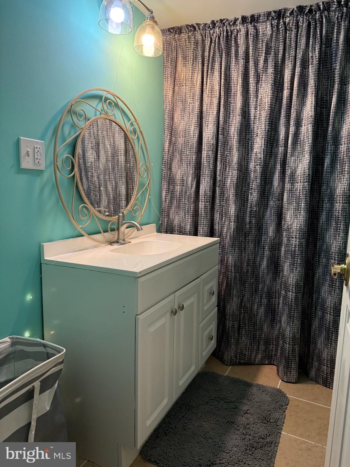 1910 Schubert Road, Unit 4 Bethel, PA 19507 - Photo 15 of 17 a bathroom with a sink a mirror and vanity
