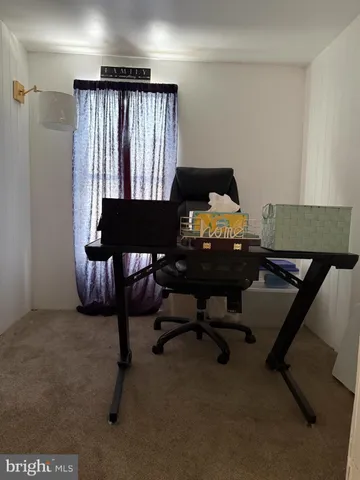 a workspace with furniture and a window