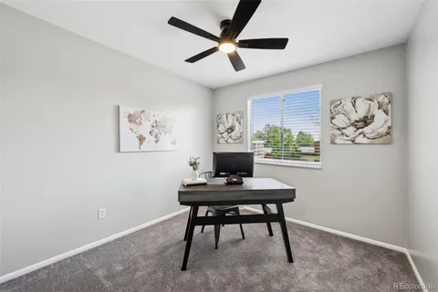 a workspace with furniture and a window