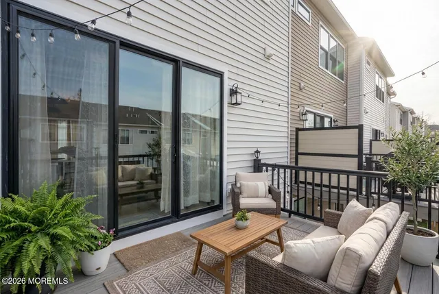 a view of a balcony with furniture