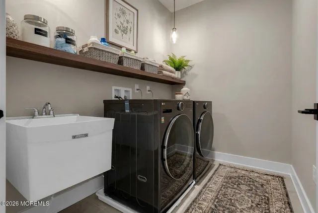 a utility room with dryer and washer