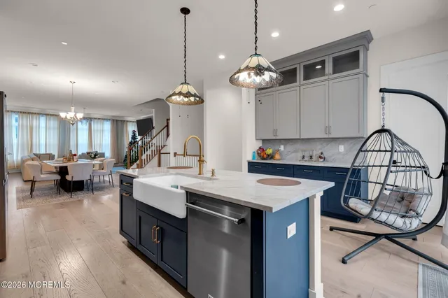 a very nice looking living room with a ceiling fan and a wooden floor