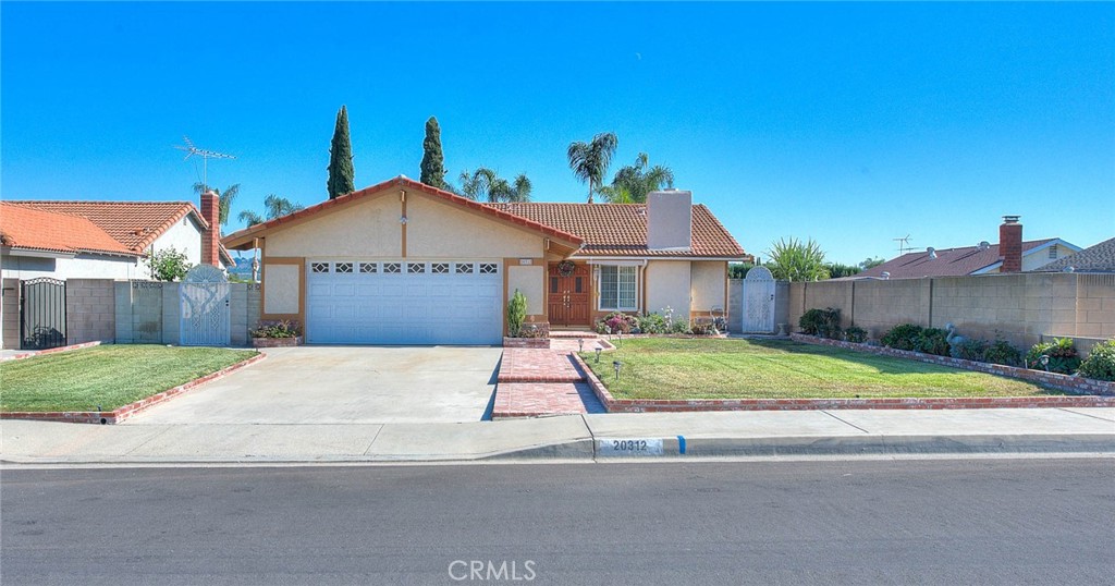 20312 East Vejar Road Walnut, CA 91789 - Photo 1 of 1 a house with a yard and wooden fence