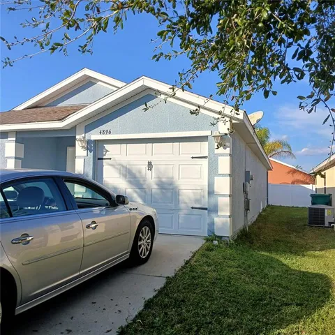 a view of a car in front of a house